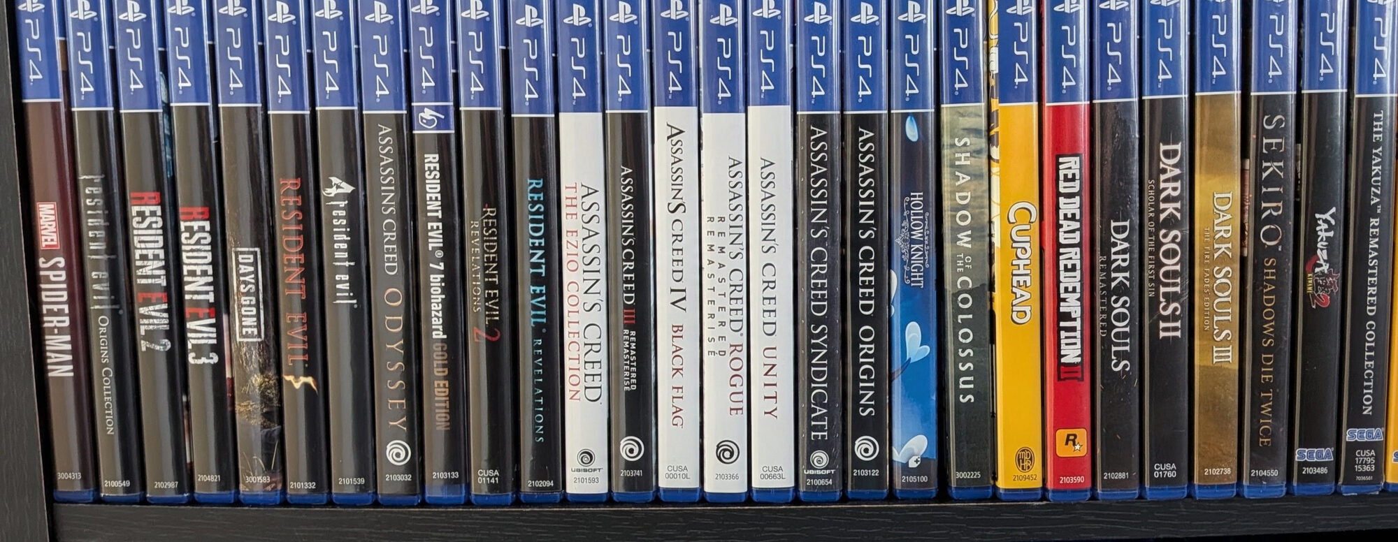 Part of my PlayStation 4 physical game collection, including Spider-Man, Resident Evil, Assassin's Creed, Dark Souls and Sekiro
