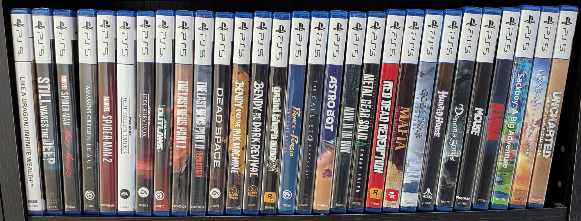 Part of my PlayStation 5 physical game collection, including The Last of Us, God of War Ragnarok, Astro Bot, Demon's Souls and Horizon